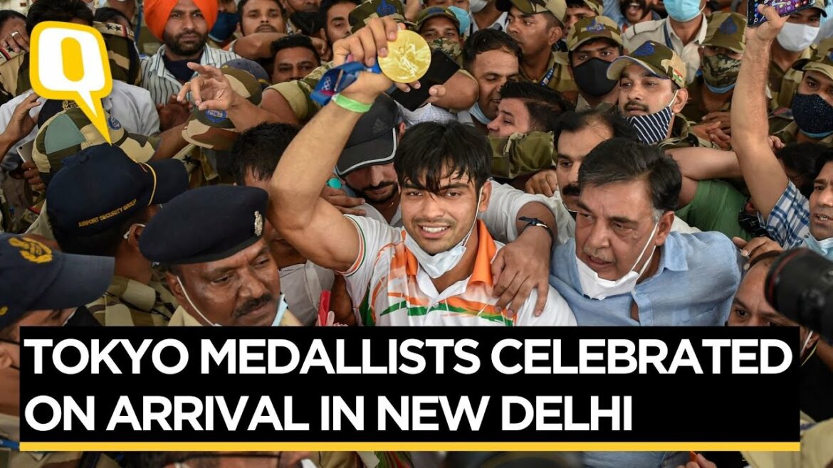 Tokyo Olympics Gold Medallist Neeraj Chopra Mobbed at Airport After Landing in India | The Quint