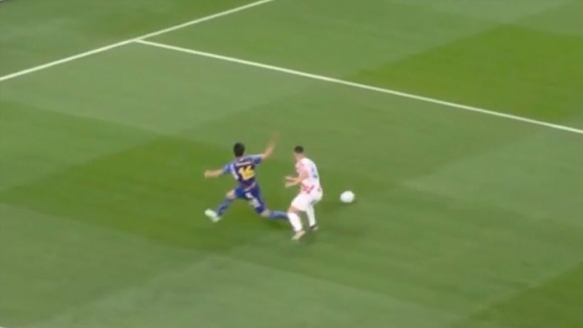 Takehiro Tomiyasu making a fake pass Takehiro Tomiyasu making a fake pass