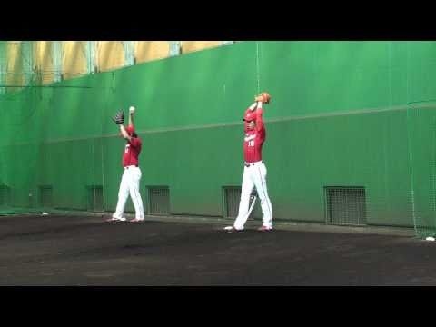 Kenta Maeda and Takeshi Imamura pitching in the bullpen Kenta Maeda and Takeshi Imamura pitching in the bullpen