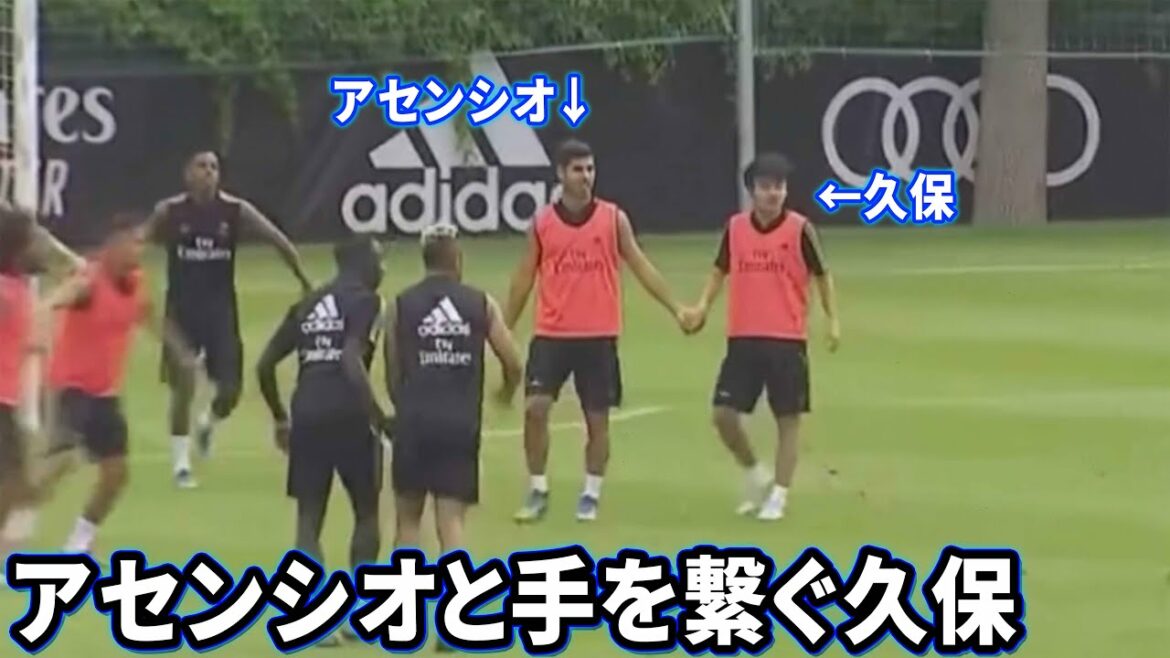 Takefusa Kubo holding hands with Asensio