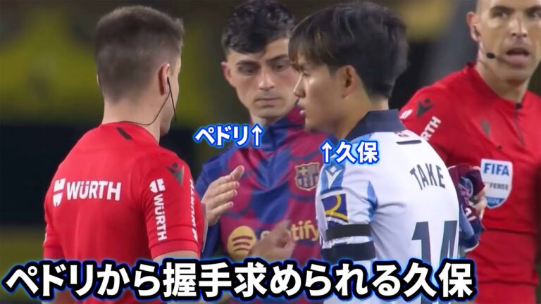 Takefusa Kubo is asked to shake hands with Pedri after the match.