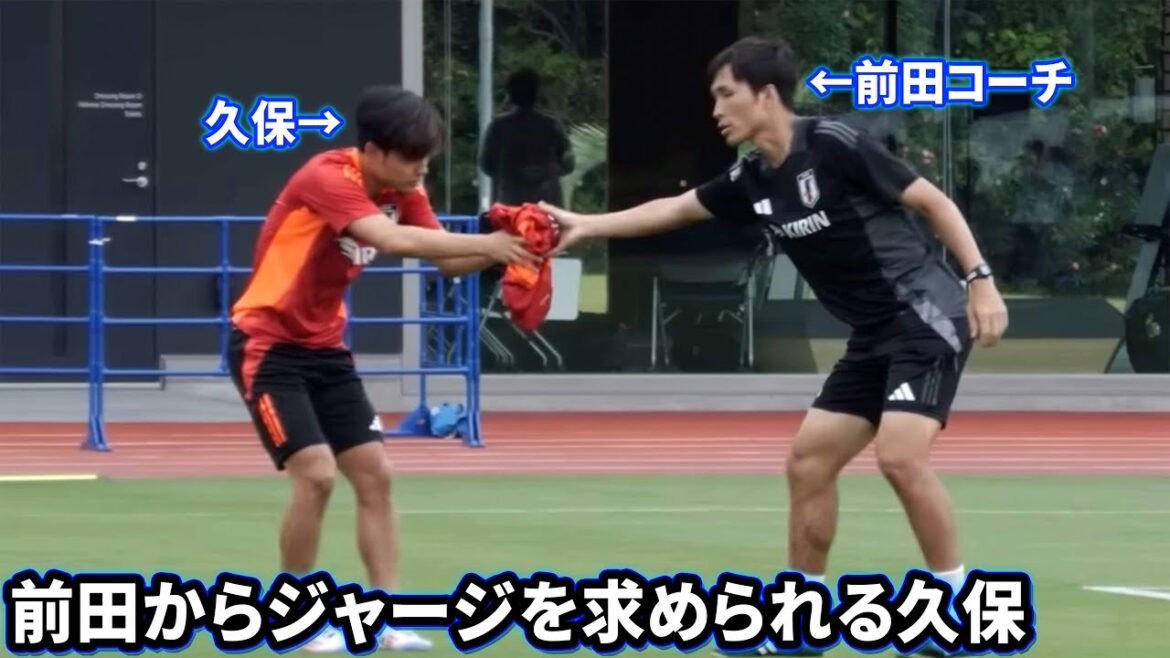 Takefusa Kubo asks for his jersey from coach Ryoichi Maeda