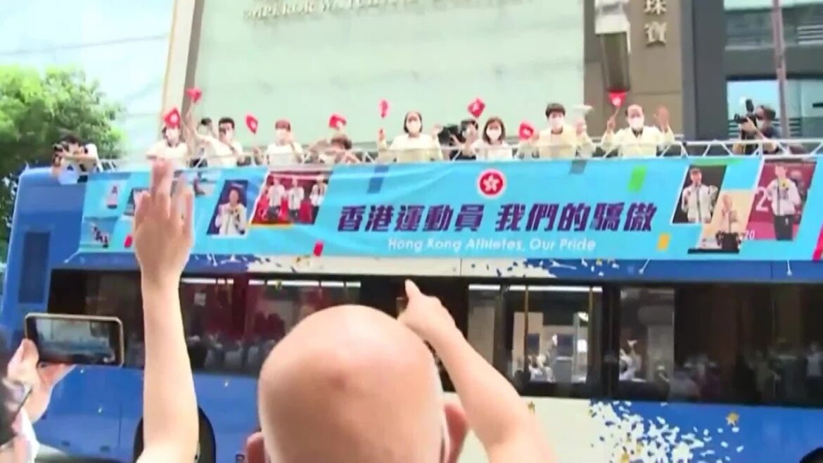Hong Kong athletes from China receive congratulations in victory parade at the Tokyo Olympics