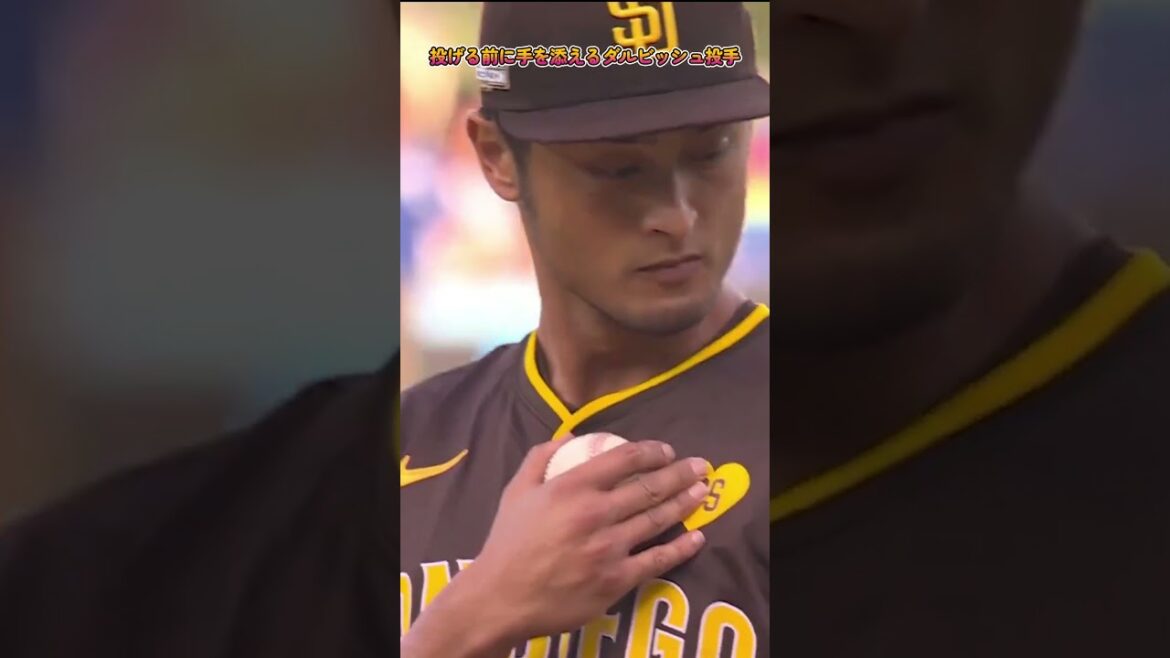 Yu Darvish places his hand on a yellow heart in honor of the late Peter Seidler before throwing it. #padres #Darvish #yudarvish