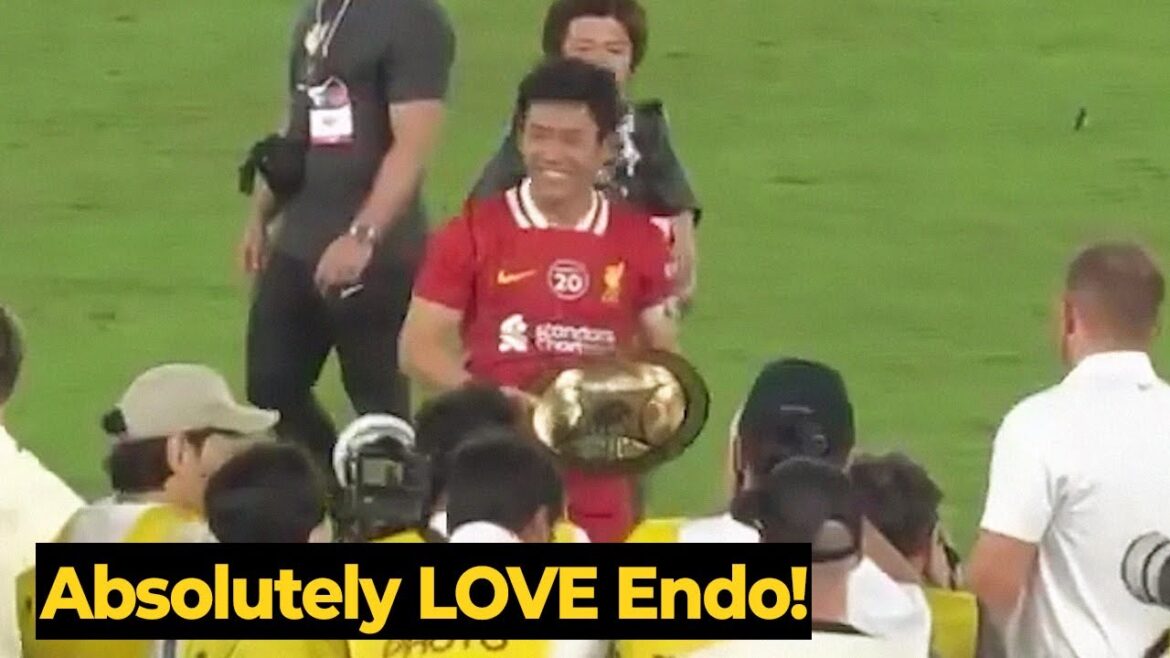 Moment Wataru Endo doing the honours of lifting the J-League World Challenge trophy for Liverpool Moment Wataru Endo doing the honours of lifting the J-League World Challenge trophy for Liverpool